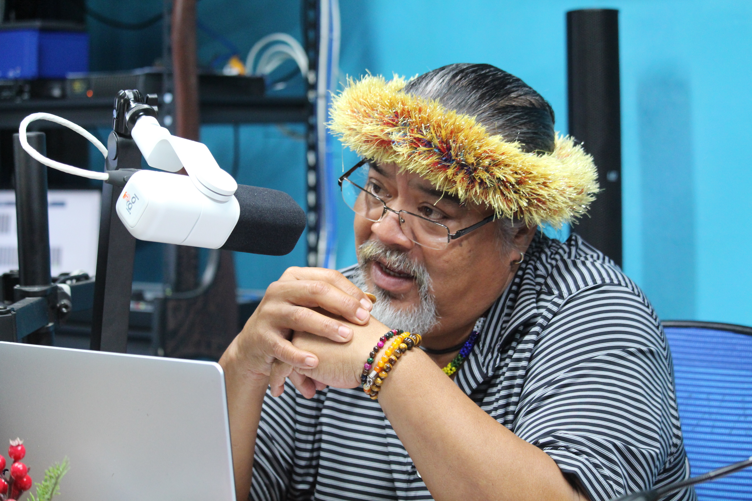 man with headdress on radio broadcast 