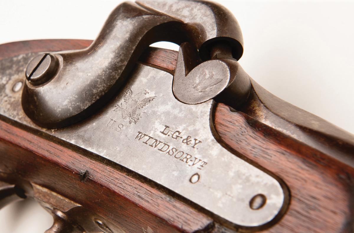 photograph of engraved plate on a gun