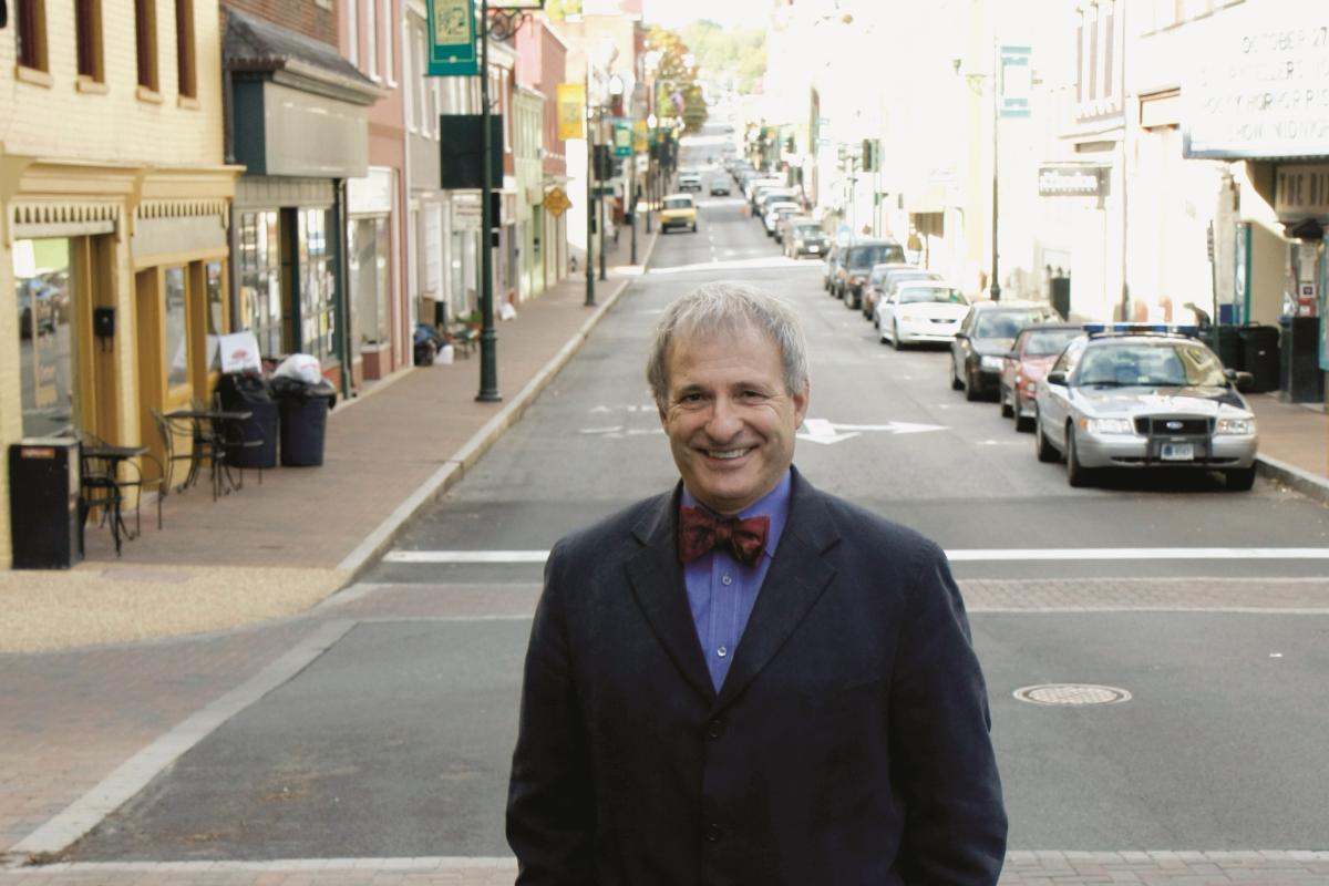 Photograph of a man standing in the road