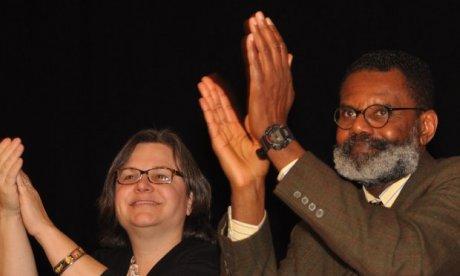 a man and a woman applauding