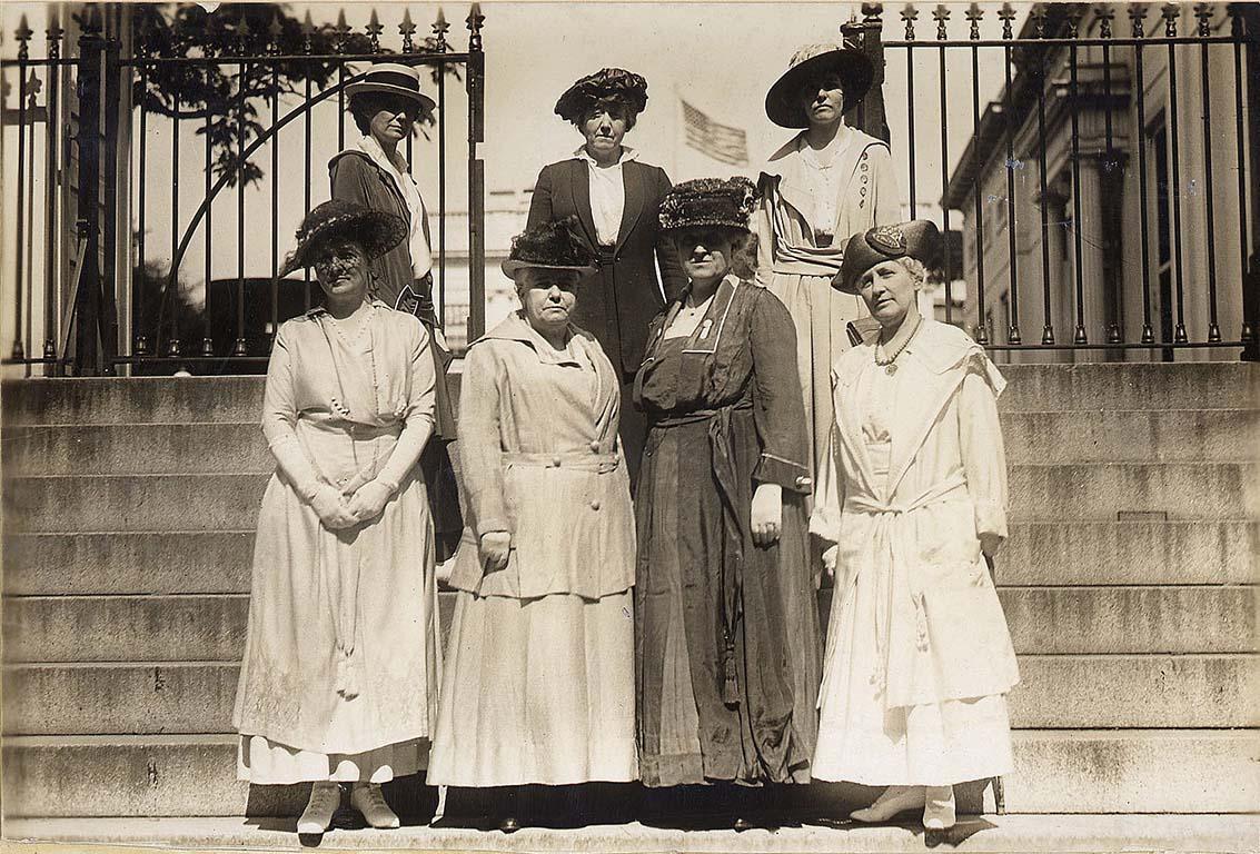 Suffragists standing outside Wilson White House, where they had made inroads