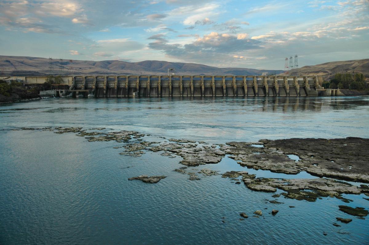 Photograph of the Dalles Dam with hills in the background.