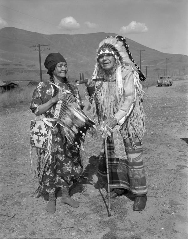 Residents of Celilo Falls. A man and woman wearing traditional Native American dress