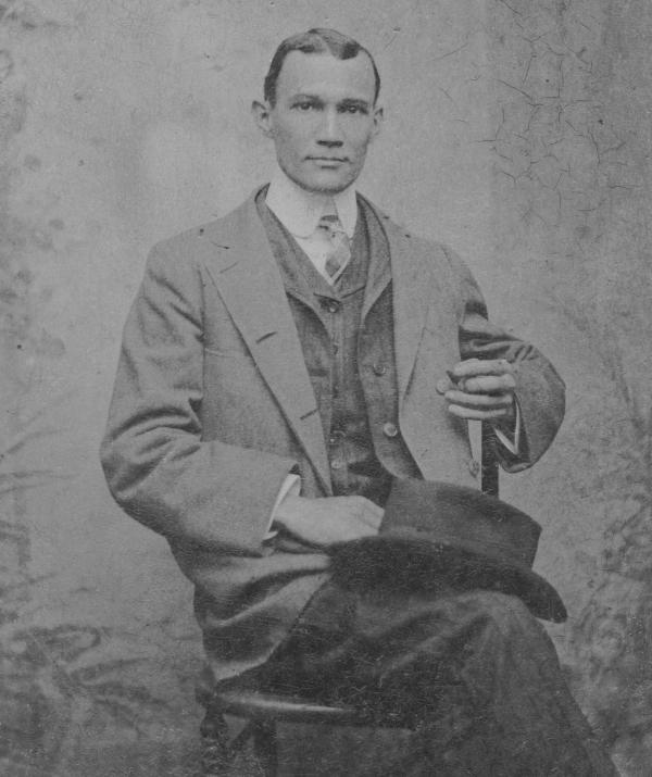 black and white portrait of newspaper editor Alex Manly.