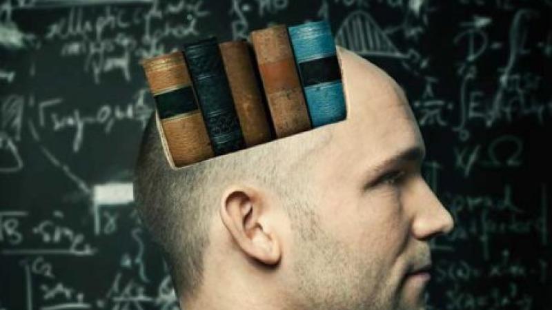 Man in profile with spine-out books superimposed on his head.