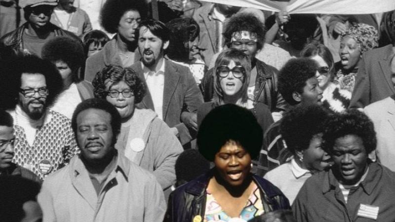 Black and white image of the march on The Strip with Ruby Duncan highlighted in color.