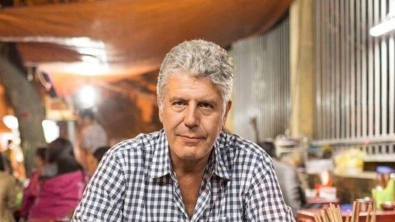 Anthony Bourdain eating a meal